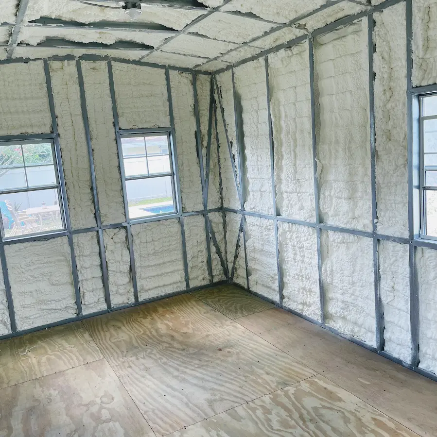 Closed-cell spray foam insulation applied to wall cavities in a residential project in Highland